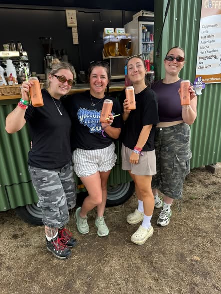 Customers enjoying The Coffee Man smoothies in sealed cans at a festival. Festival coffee van catering
